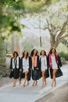 four women walking down the street together