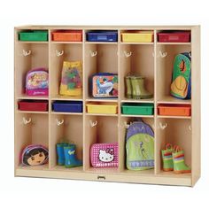 a wooden shelf filled with lots of different types of children's bags and toys