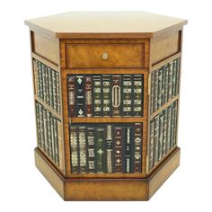 a wooden cabinet with many books on it