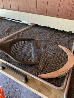 two tennis racquets laying on the ground