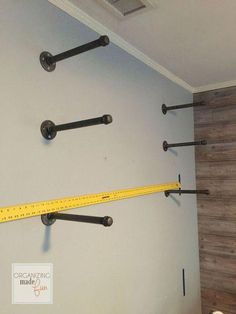 there is a measuring tape hanging on the wall