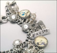 A Paris charm bracelet! Antique Bracelets With Vintage Charm As Gift, Vintage Engraved Charm Bracelet Gift, Antique Souvenir Jewelry With Charms, Antique Adjustable Charm Bracelet Gift, Vintage Adjustable Engraved Charm Bracelet, Vintage Adjustable Charm Bracelet With Engraving, Personalized Vintage Bracelet Jewelry, Personalized Bracelet Jewelry As Souvenir, Nickel-free Silver Bracelets As Souvenir