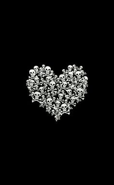 a black and white photo with skulls in the shape of a heart on a black background