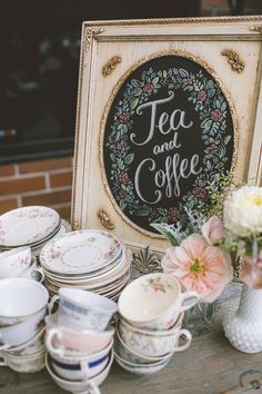 a table topped with lots of cups and saucers