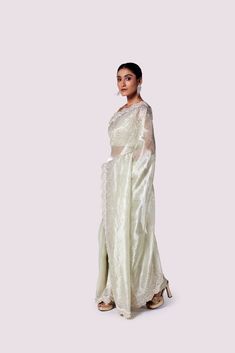 Look like a royalty in this stunning mint green embroidered organza saree at weddings and special occasions. It comes with a beautiful designer blouse. Luxury Pista Green Organza Pre-draped Saree, Pista Green Organza Saree, Pista Green Organza Pre-draped Saree, Bollywood Style Pista Green Organza Pre-draped Saree, Pista Green Embellished Semi-stitched Saree, Kanjivaram Sarees, Fashion Journals, Organza Saree, Traditional Fabric