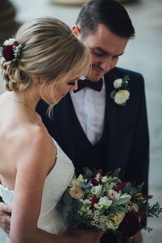 a bride and groom looking at each other