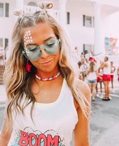 a woman wearing sunglasses and a tank top with the words south by sea on it