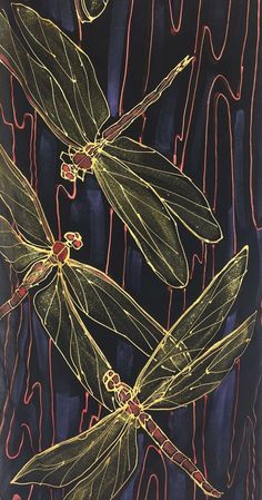 three yellow dragonflies sitting on top of a black surface with red and blue lines