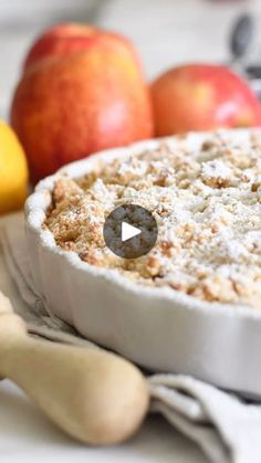 an apple crumb pie sitting on top of a table