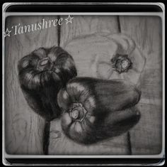 a pencil drawing of some kind of fruit on a wooden table with stars in the background