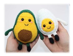 two small crocheted stuffed animals in the palm of someone's hand