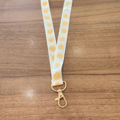 the lanyard strap has yellow flowers on it