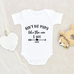 "Cute Unisex Baby Onesie® Ain't No Mimi Like The One I Got Personalized Name Baby Onesie® Funny Grandma Onesie® Cute Grandma Onesie® Our amazing and cutest personalized Ain't No Mimi Like The One I Got Personalized Name Baby Onesie® is 100% cotton, designed, printed and pressed. Perfect for your cute little ones that you can buy on Etsy! Onesies® are printed on Gerber organic. These tend to run small so we recommend sizing up. All of our leahdecorations clothing are 100% organic ultra-soft fabri Funny Onsie Ideas, Auntie Baby Clothes, Aunt Baby Clothes, Baby Clothes Funny, Crafts 2024, Onesie Ideas, Auntie Baby, Funny Baby Onesie, Funny Baby Gifts