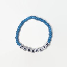 The perfect bracelet for anyone who loves this borough in NYC.  Brooklyn-themed bracelets with customized color options.  The perfect gift for yourself or for someone else! The bracelets are stretchy and will fit a variety of wrist sizes, but please specify if it is for a child or small/large adult. (If no specification, it will be made average size) IF you would like this style bracelet to say something else, check out our other listing below. https://www.etsy.com/listing/773122283/customized-name-bracelet?ref=shop_home_active_4  Feel free to reach out with any other questions or concerns! **Not recommended for children under 4 years old ** Casual Blue Name Bracelet With Letter Beads, Trendy Blue Name Bracelet With Letter Beads, Brooklyn Charm Bracelet, Bed Stuy Brooklyn, Lauren Smith, Brooklyn Shirt, Brooklyn New York, Brooklyn Nine Nine, Name Bracelet