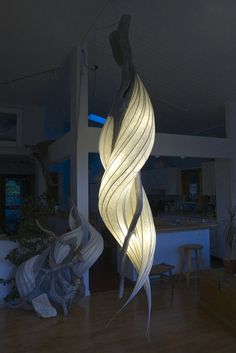 a large light hanging from the ceiling in a living room