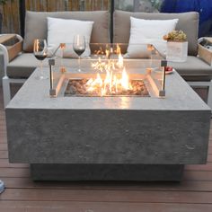 a fire pit sitting on top of a wooden deck