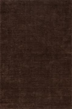 an area rug with dark brown colors