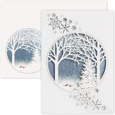 two cards with trees and snowflakes on them, one is cut out to look like