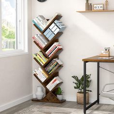 a bookshelf in the corner of a room with a desk and chair next to it