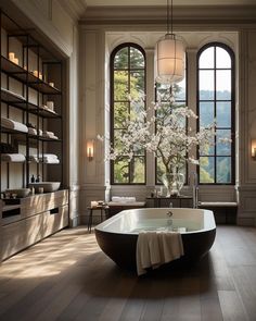 a large bathroom with an oval tub and windows