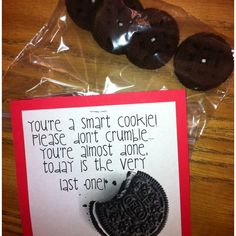 an oreo cookie is on the table next to a card that says, you're a smart cookie please don't crumble