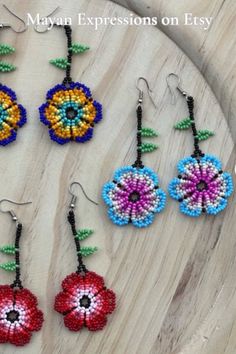 Thank you for your support. Check out Mayan Expressions on Etsy for more colors and designs. Traditional Flower Shaped Earrings For Festivals, Traditional Flower Earrings For Festival, Traditional Flower-shaped Earrings For Festivals, Multicolor Bohemian Earrings With Flower Charm, Multicolor Flower Beaded Earrings For Festival, Bohemian Multicolor Earrings With Flower Charm, Multicolor Floral Beaded Earrings For Festivals, Multicolor Flower Earrings For Festival, Festival Multicolor Flower Beaded Earrings