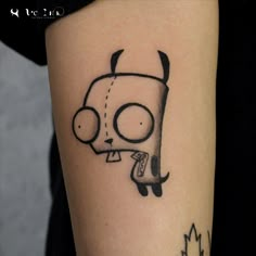 a cartoon character tattoo on the arm