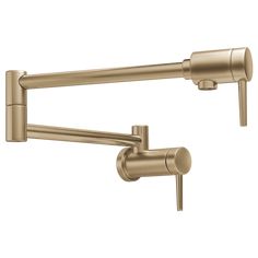 an image of a kitchen faucet with two handles and one arm in brushed brass