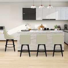 an image of a modern kitchen setting with bar stools and island in the middle