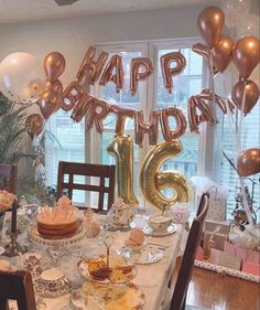 a birthday party with balloons and decorations