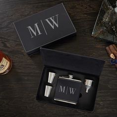 two personalized flasks in a black box