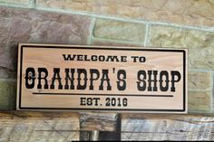 Carved Wood Shop Sign  Personalized Workworking Gift Grandpa Dad / Custom Workshop Garage Shop Established Engraved Outdoor Indoor Sign This Custom Workshop Woodshop Sign makes the perfect statement hanging in the shop or office. Introduce your business or home workshop with a stylish sign that is sure to catch the eye of your customers or guests. Our Workshop Sign is expertly carved from high-quality cedar, ensuring that it will make a lasting impression. Whether you choose to hang it indoors or outdoors, this sign is an excellent way to showcase your brand or business. DETAILS *The text color is black. *Carved deeply to give a beautiful 3D appearance. *Made to order and 100% unique. *We consider variations in color, grain, or knots part of what makes woods such a wonderful natural produc Workshop Sign, Workshop Garage, Shop Sign, Home Workshop, Garage Shop, Garage Workshop, Grandpa Gifts, Personalized Signs, Shop Signs