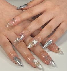 a woman's hands with different manies and nail designs on their fingertipss