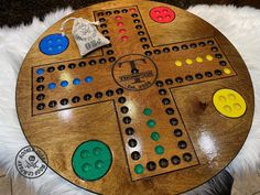 a wooden board game sitting on top of a white rug