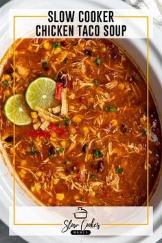 slow cooker chicken taco soup in a white bowl with lime and cilantro