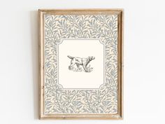 a framed drawing of a dog on a wall