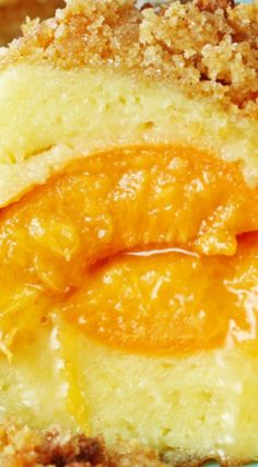 a piece of cake with oranges on it and crumbs around the edges