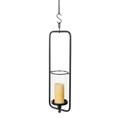 a candle hanging from a metal holder