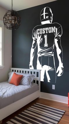 a bedroom with a football player wall decal