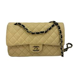 This Vintage Chanel Shoulder Bag Is A Must-Have For Any Fashion-Forward Woman. Crafted From High-Quality Leather, It Features A Timeless Beige And Black Design With Subtle Hardware Accents. The Small Size And Convenient Strap Make It Perfect For On-The-Go Occasions. The Interior Is Lined With Luxurious Lambskin In A Matching Beige Color, Providing A Soft And Elegant Touch. Whether You're Dressing Up Or Down, This Classic Chanel Bag Is Sure To Elevate Any Outfit. Good Vintage Condition. No Major Blemishes. Includes Box, Authenticity Card, Dust Bag. Classic Chanel Bag, Classic Chanel, Chanel Shoulder Bag, Beige And Black, Chanel Vintage, Chanel Bags, Vintage Chanel, Flap Bag, Black Design