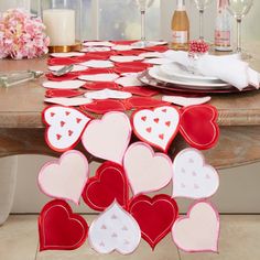 valentine's day table setting with red and white hearts