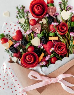 a paper bag filled with lots of different types of flowers