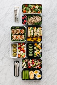 an assortment of food is arranged in the shape of a rectangle on a marble surface