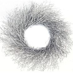 a wreath made out of branches on a white background