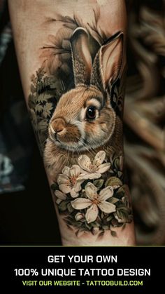 a rabbit with flowers on it's arm and the words get your own unique tattoo design