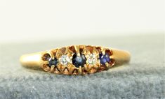 This is a wonderful 5 stone Sapphire and Diamond Ring.  It is in the classic Victorian style that presents the stones in such a beautiful way.  The ring is size 9 and can be sized by your local jeweler.   I like being able to offer rings in larger sizes for my customers.  It is in rich 18K gold and weighs 4.1 grams.