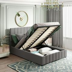 a bed that is sitting in the middle of a room with a mattress on top of it