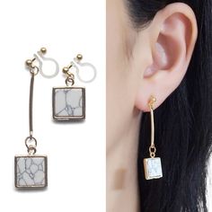 Square stone clip on earrings dangle. long asymmetric white marble invisible clip on earrings. gold clip earrings, non pierced earrings🌟MiyabiGrace shop home. More invisible clip on earrings: click here   https://www.etsy.com/shop/MiyabiGraceDetails◆Length:1 7/9 inches (4.5 cm)◆Weight:4 g (0.14 oz)◆Stone: Faux White Stone◆Shape: Square★Payment: PayPalYou can checkout without PayPal account. You can use your credit card though PayPal for payment.  https://www.etsy.com/listing/493072802/how-to-co Trendy White Metal Clip-on Earrings, Modern White Clip-on Jewelry, White Dangle Clip-on Jewelry, Minimalist White Single Clip-on Earring, White Minimalist Single Clip-on Earring, White Dangle Clip-on Earrings, White Single Dangle Clip-on Earring, Adjustable White Dangle Clip-on Earrings, Minimalist Dangle Clip-on Earrings