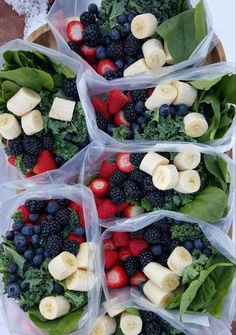 four plastic bags filled with fruit and veggies