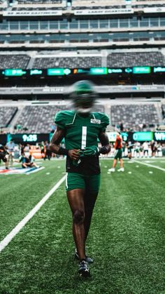 a football player is running on the field